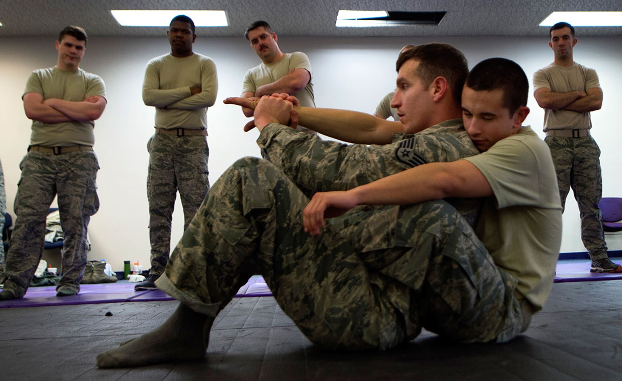 U.S. Air Force Staff Sgt. Heath Parish demonstrates one of the 29 combative techniques to Senior Airman Sean Pender during a combative training at Joint Base Elmendorf-
Richardson, Alaska, November 9, 2015. All Security Forces Squadron members are required to stay proficient in combative tactics. Parish and Pender are both assigned to the 673d SFS. (U.S. Air Force photo by Staff Sgt. Sheila deVera)