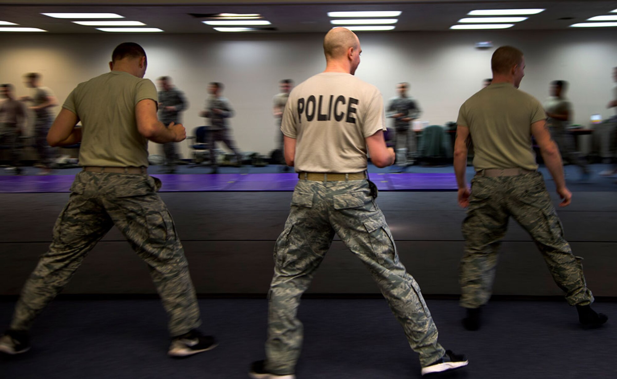 Defenders assigned to the 673d Security Forces Squadron conduct pre-drill warmup during
combative training at Joint Base Elmendorf-Richardson, Alaska, November 9, 2015. More than 50 defenders and two flights participated in the training to hone their skill. (U.S. Air
Force photo by Staff Sgt. Sheila deVera)