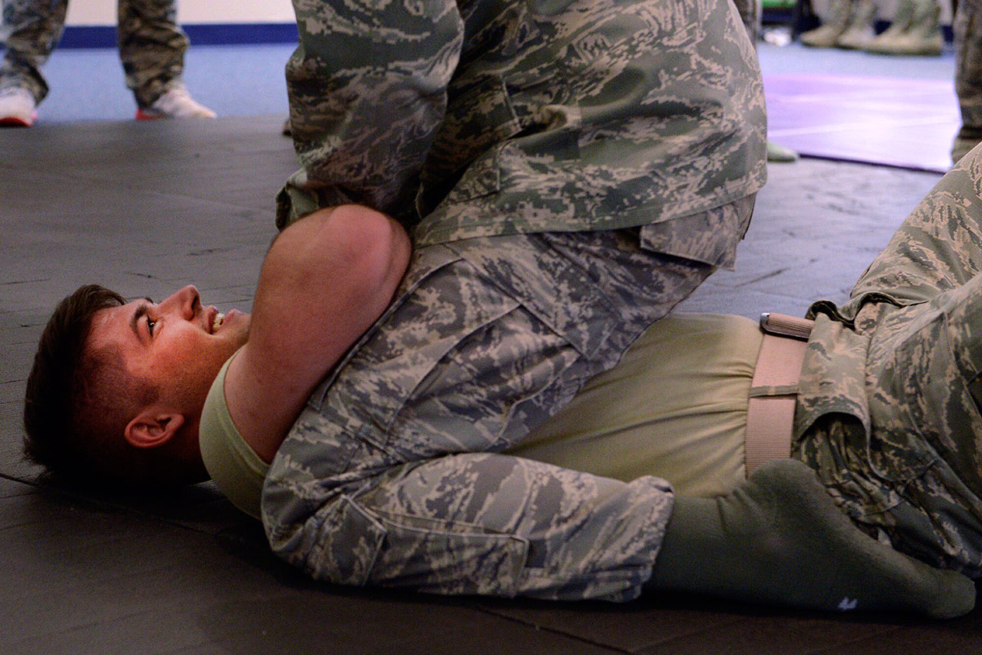 Airman 1st Class Christian Thomas, assigned to the 673d Security Forces Squadron, is held in a non-dominant position during combatives training at Joint Base Elmendorf-Richardson, Alaska, Nov. 9, 2015. The combatives training is part of the 673d SFS yearly required training. (U.S. Air Force photo by Airman Valerie Monroy