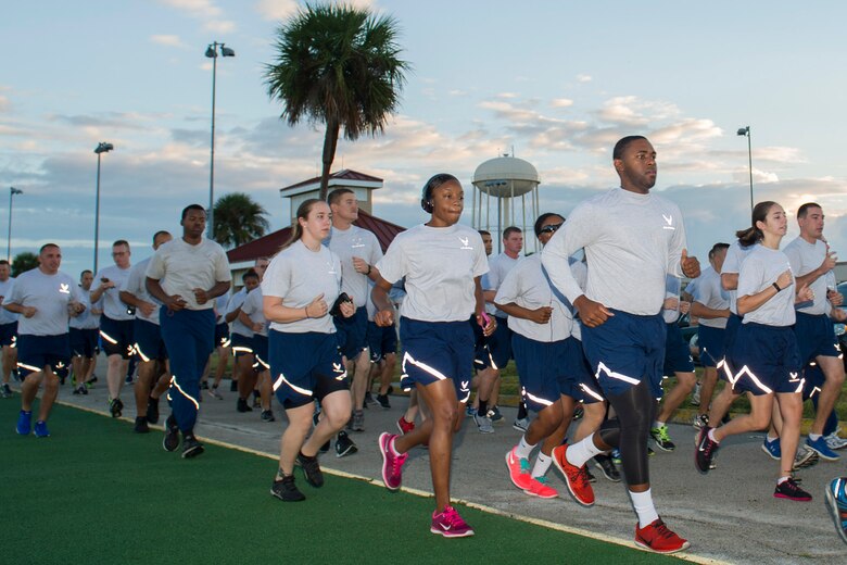 Airmen participate in a Wingman Day Run Nov. 20, 2015 at Patrick Air Force Base, Fla. The theme is Wingman Make The Difference and focused on Resiliency, which is the ability to withstand, recover and grow in the face of challenge. Wingman Day touches on all four Comprehensive Airman Fitness domains of wellness, which are:  physical, mental, social and spiritual in efforts to create positive behaviors in the force and help Airmen, civilians and their family members build resiliency skills. (U.S. Air Force photo/Matthew Jurgens/Released) 
