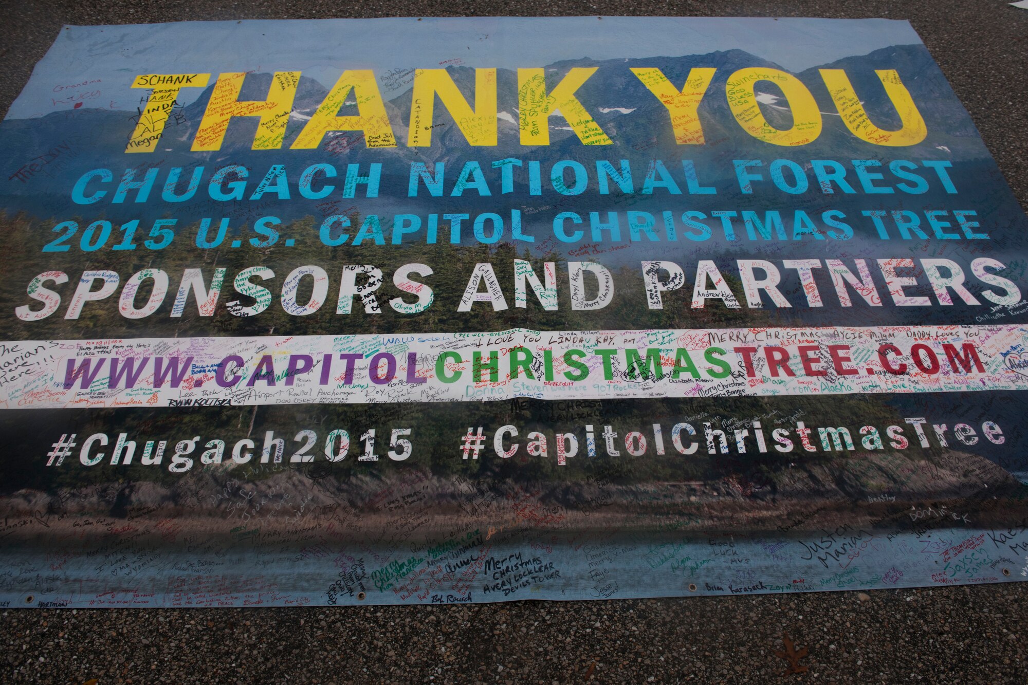 A Capitol Christmas Tree sign is displayed, at Joint Base Andrews, Md., Nov. 19, 2015. This year’s Capitol Christmas Tree is 74 feet tall and is a Lutz Spruce. This year’s Capitol Christmas Tree is 74 feet tall and is a Lutz Spruce. It stopped 14 times on the trip, from Chugach National Forest in Seward, Alaska, to JBA. Its final destination is outside the U.S. Capitol building. (U.S. Air Force photo by Senior Airman Dylan Nuckolls/Released)