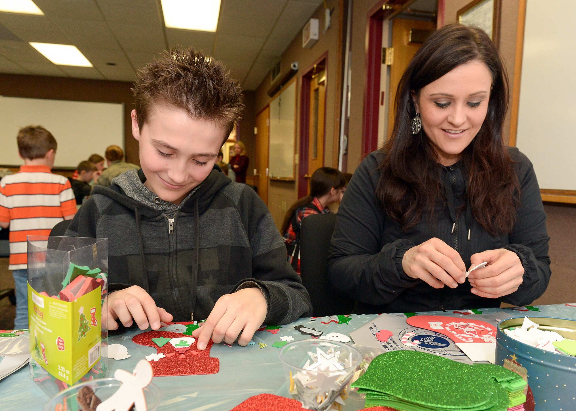 Tammy Stoddard, and her son, Colby, participate in an arts and crafts event at the Airman and Family Readiness Center Nov. 18 as part of Month of the Military Family. Since 1993, the month of November has been recognized as Month of the Military Family across the Department of Defense as a way to thank all family members. (U.S. Air Force photo by Jerry Saslav)
