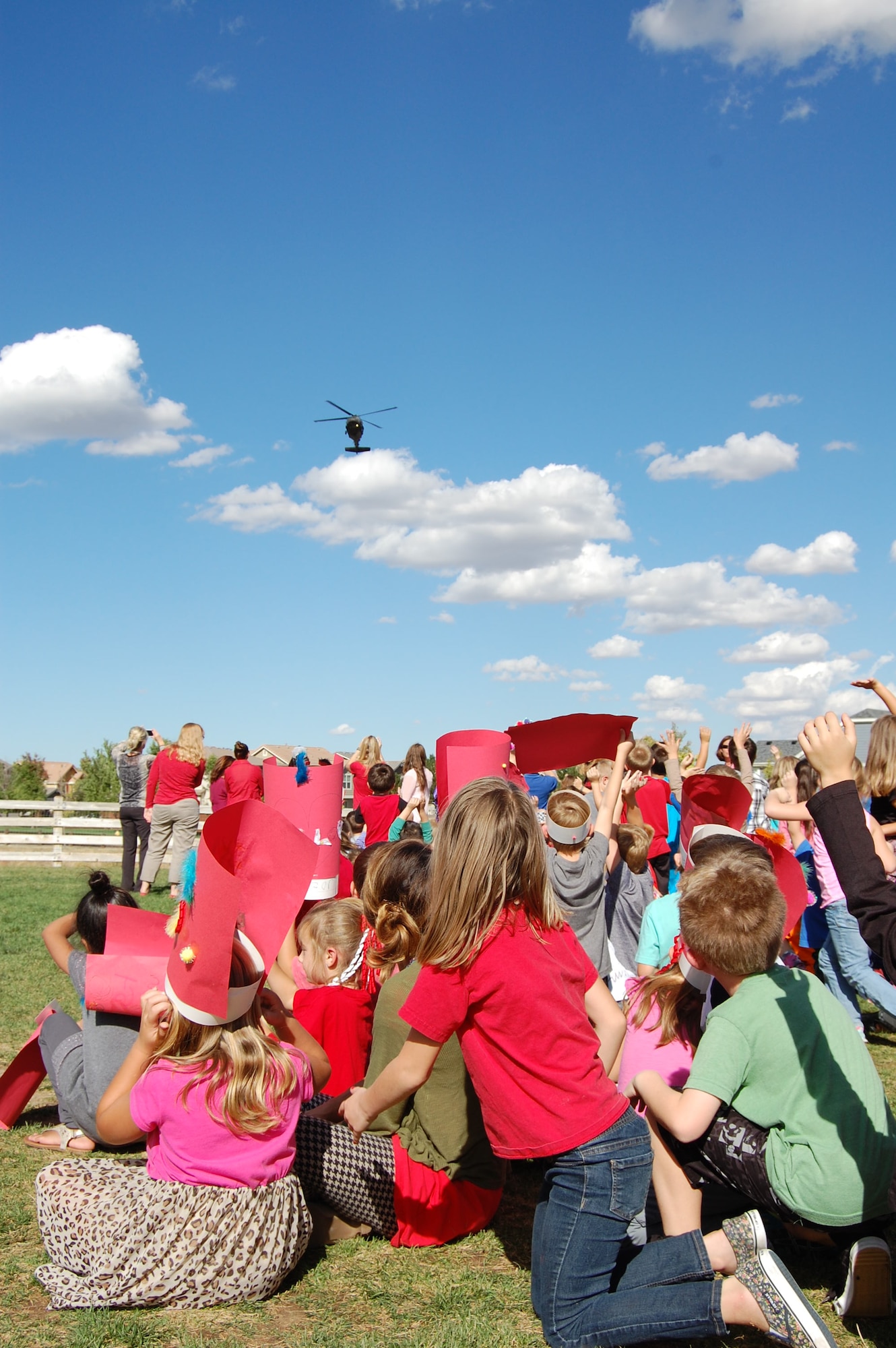 Students anxiously await a visit from a Colorado Army National Guard UH-60 Blackhawk and the Colorado National Guard's Joint Counterdrug Task Force during Red Ribbon Week, October 7, 2015. The Colorado National Guard's Joint Counterdrug Task Force conducts almost a hundred visits like this over the course of each year in an effort to inspire kids in Colorado to stay drug-free. (US Air National Guard photo by Capt. Kinder Blacke)