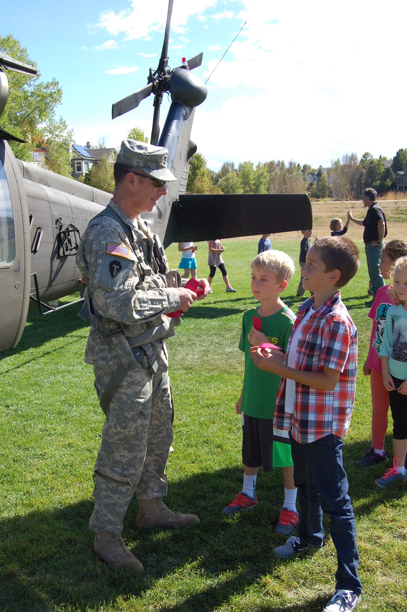 Lt. Col. Robert Soper, UH-60 pilot, Colorado Army National Guard, visits with students during a visit from the Colorado National Guard's Joint Counterdrug Task Force during Red Ribbon Week, October 7, 2015. The Colorado National Guard's Joint Counterdrug Task Force conducts almost a hundred visits like this over the course of each year in an effort to inspire kids in Colorado to stay drug-free. (US Air National Guard photo by Capt. Kinder Blacke)