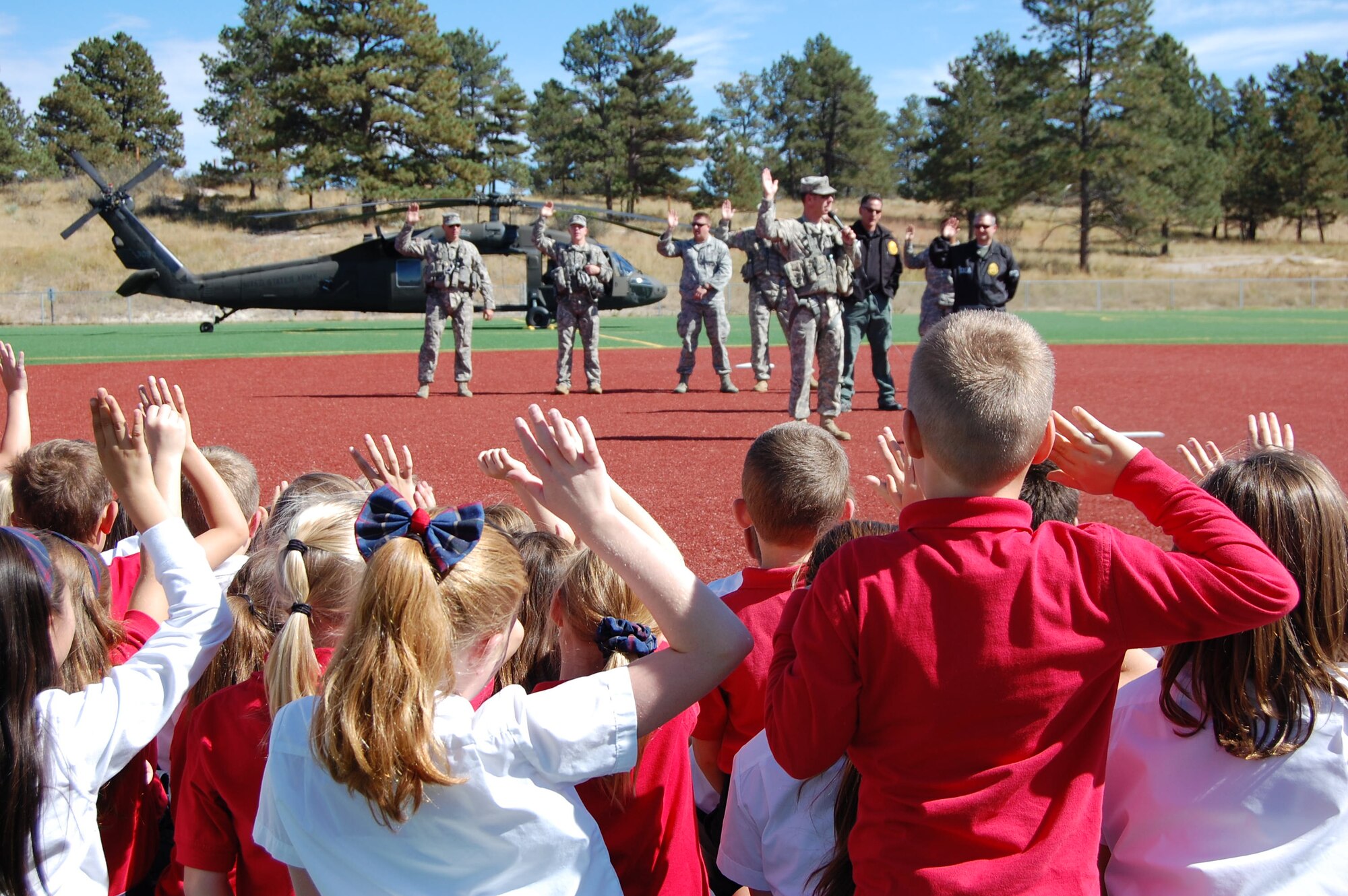 Students at Ave Maria Catholic School, Parker, Colo., take the Oath to be Drug Free during a visit from the Colorado National Guard's Joint Counterdrug Task Force during Red Ribbon Week, October 7, 2015. The Colorado National Guard's Joint Counterdrug Task Force conducts almost a hundred visits like this over the course of each year in an effort to inspire kids in Colorado to stay drug-free. (US Air National Guard photo by Capt. Kinder Blacke)