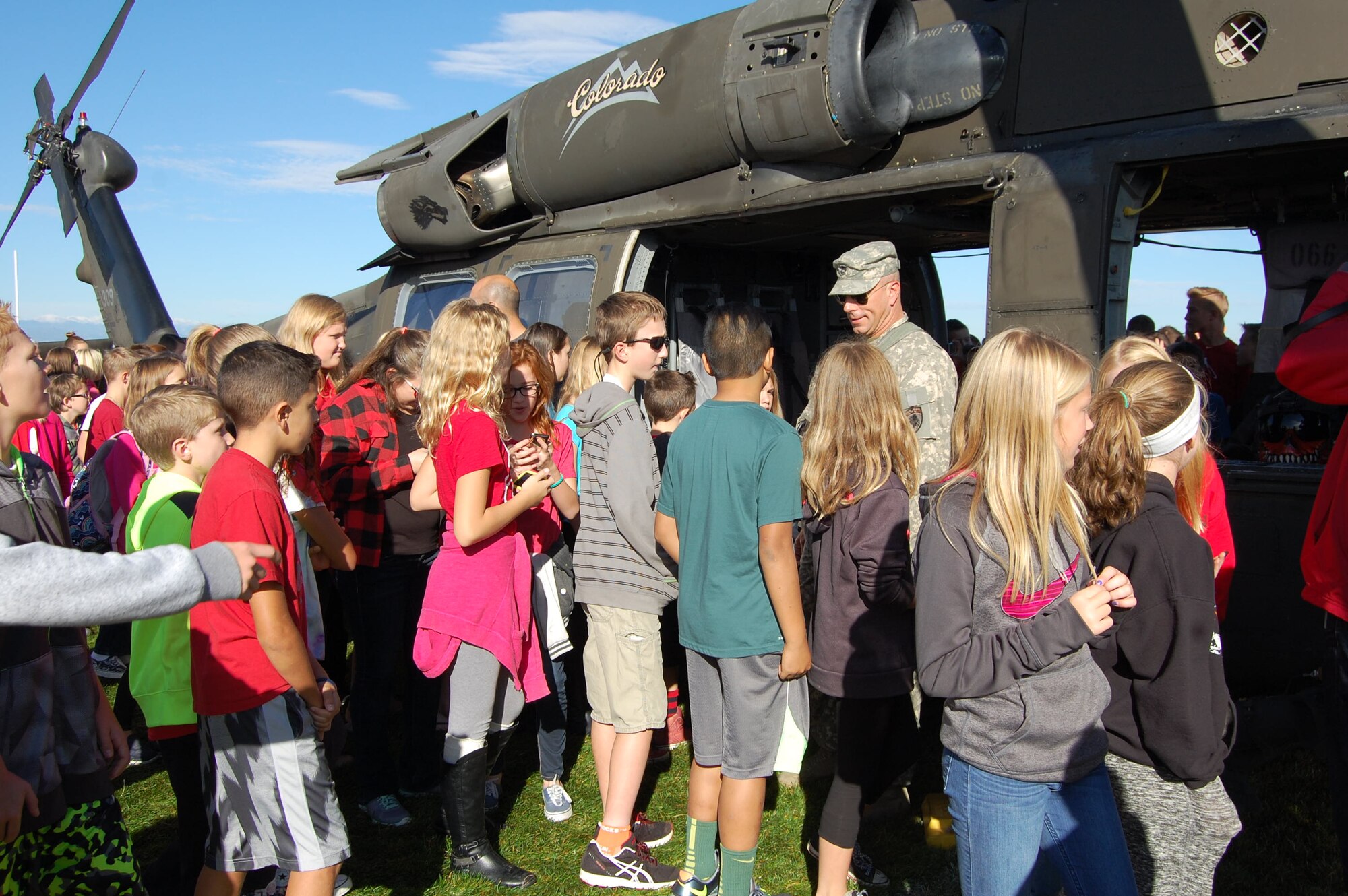 Staff Sgt. Marc Belo, UH-60 crew chief, Colorado Army National Guard, talks to students at Cimarron Middle School during a Red Ribbon Week school visit. The Colorado National Guard's Joint Counterdrug Task Force conducts almost a hundred visits like this over the course of each year in an effort to inspire kids in Colorado to stay drug-free. (US Air National Guard photo by Capt. Kinder Blacke)