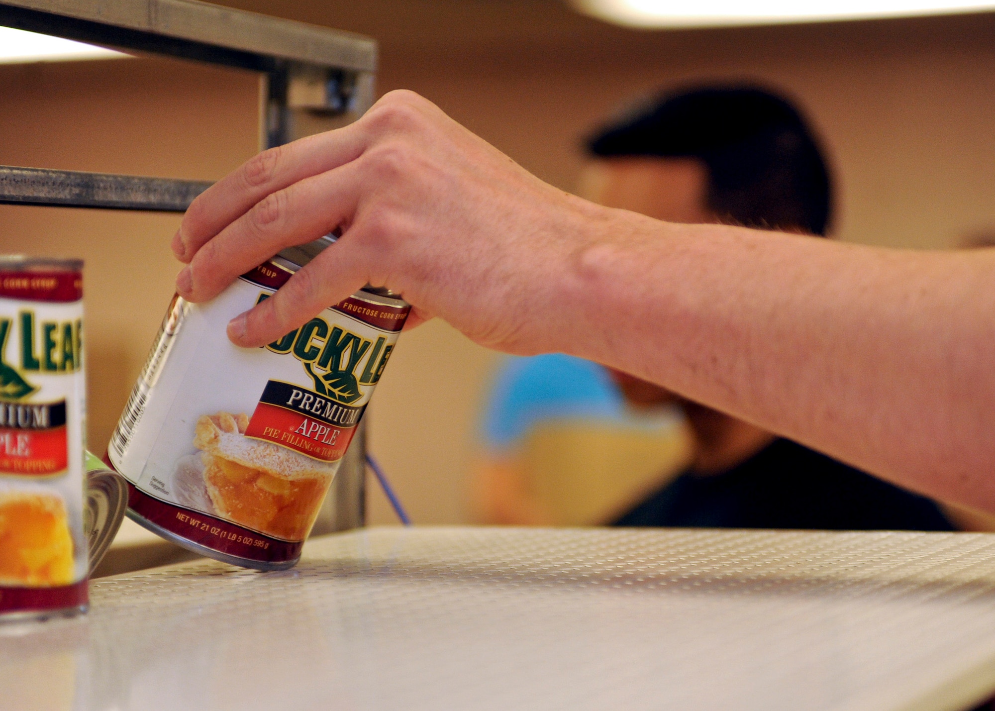 Apple pie fillings were one of many items included in packages for Operation Warmheart at Ellsworth Air Force Base, S.D., Nov. 14, 2015. Approximately 31 Airmen assisted in assembling and delivering more than 150 boxes of food for families this Thanksgiving holiday. (U.S. Air Force photo by Airman Sadie Colbert/Released)