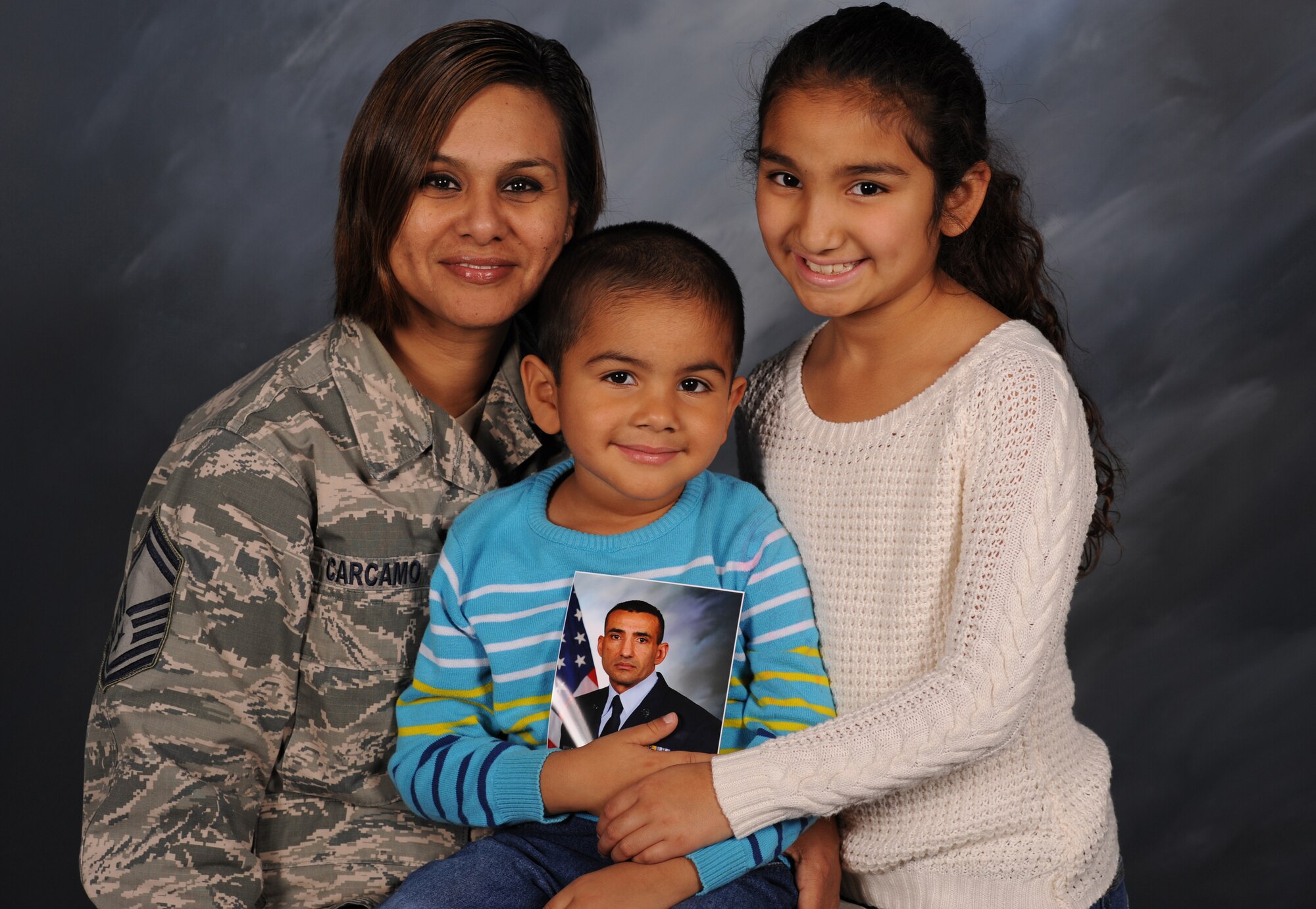 Senior Master Sgt. Claudia Carcamo, her husband Chief Master Sgt. Marlon Carcamo and their two children, Alessia and Javier, have been stationed at Grand Forks Air Force Base, North Dakota for almost three years. Chief Carcamo is the 319th Logistics Readiness Squadron chief enlisted manager and Sergeant Carcamo is the 319th Air Base Wing executive superintendent. The Carcamos have been in the Air Force for a combined 44 years and they have experienced the challenges associated with having a military to military marriage. They rely on each other and the support of their Air Force family to ensure the well-being of their family. (U.S. Air Force photo by Senior Airman Desiree Economides/Released)