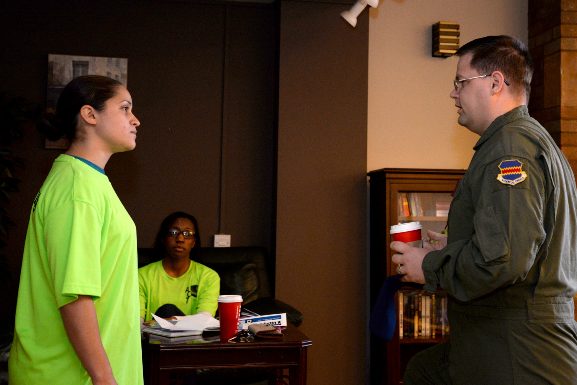 U.S. Air Force Staff Sgt. David Persons, 488th Intelligence Squadron airborne cryptologic language analyst, “says something” to U.S. Air Force Staff Sgt. Sonia Toro-Valles, left, 100th Security Forces Squadron operations support, and U.S. Air Force Staff Sgt. Candice Oliver, 100th Force Support Squadron military personnel customer support supervisor, during a surprise “Say Something” demonstration Nov. 20, 2015, at the Bob Hope Community Center on RAF Mildenhall, England. “Say Something,” the newly created bystander-intervention campaign, provides real-life scenarios of inappropriate behavior in public settings to test Team Mildenhall’s ability to step-up and step-in. The skits performed range from a minor disagreement in the wrong setting, to inappropriate behavior with sexual overtones, and are designed to encourage everyone to step-in and stop the event when necessary. (U.S. Air Force photo by Senior Airman Kate Thornton/Released)