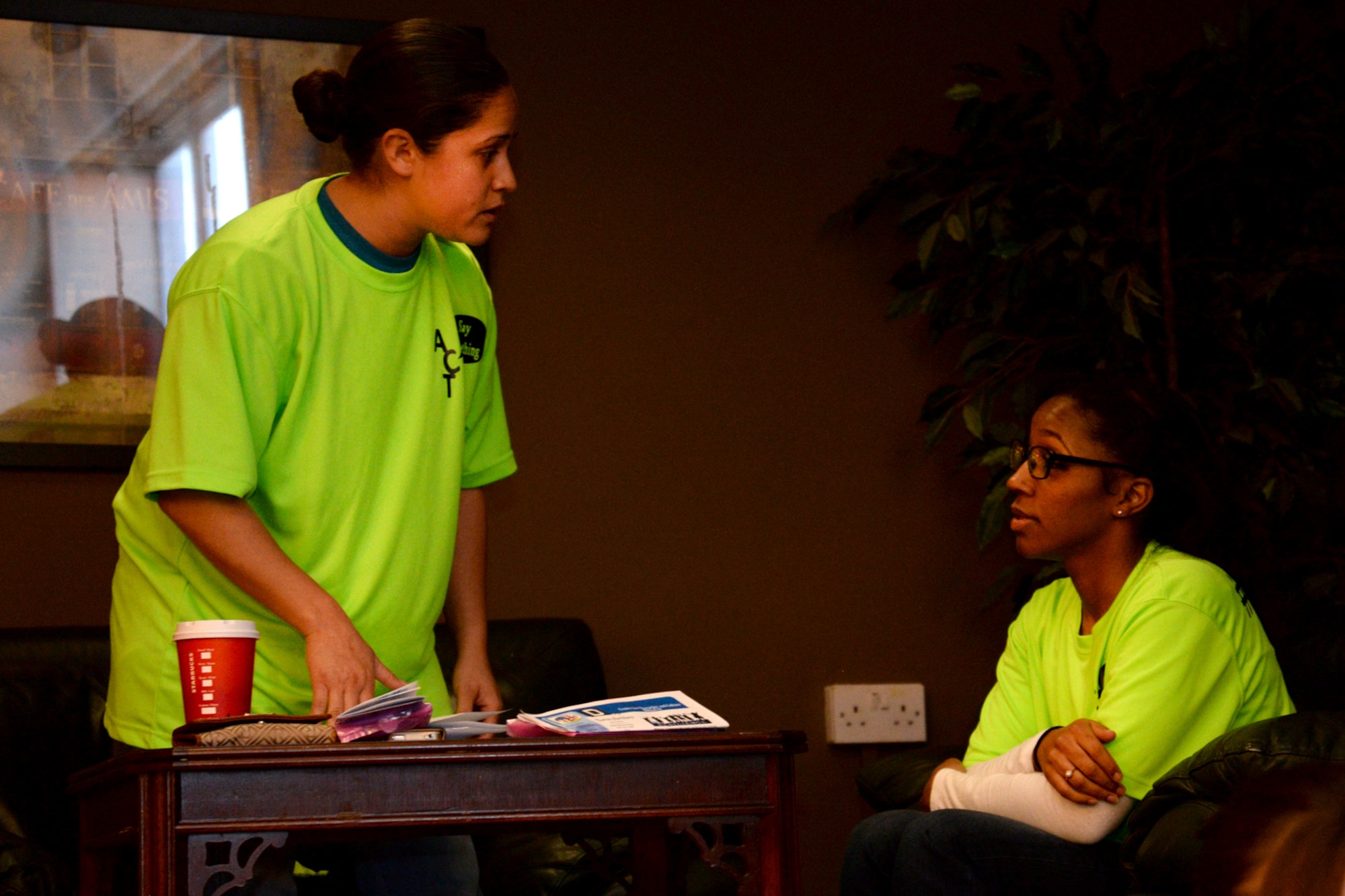 U.S. Air Force Staff Sgt. Sonia Toro-Valles, left, 100th Security Forces Squadron operations support member, and U.S. Air Force Staff Sgt. Candice Oliver, 100th Force Support Squadron military personnel customer support supervisor, act out a loud and inappropriate feedback session during a “Say Something” demonstration Nov. 20, 2015, at the Bob Hope Community Center on RAF Mildenhall, England. “Say Something,” the newly created bystander-intervention campaign, provides real-life scenarios of inappropriate behavior in public settings to test Team Mildenhall’s ability to step-up and step-in. The skits performed range from a minor disagreement in the wrong setting, to inappropriate behavior with sexual overtones, and are designed to encourage everyone to step-in and stop the event when necessary. (U.S. Air Force photo by Senior Airman Kate Thornton/Released)