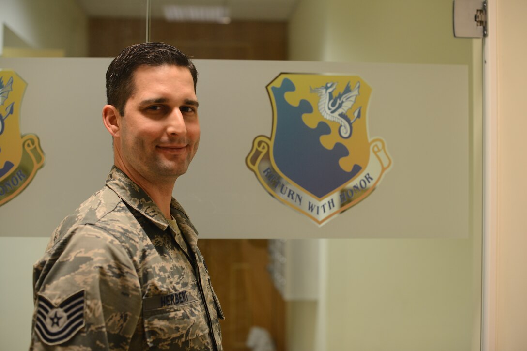 U.S. Air Force Tech. Sgt. Justin Herbert, 31st Operations Support Squadron Force Protection NCO in charge, was named the 31st Fighter Wing’s “Wyvern Warrior of the Week,” during a wing staff meeting, Nov. 19, 2015, at Aviano Air Base, Italy. Herbert was recognized by Brig. Gen. Barre R. Seguin, 31st Fighter Wing commander, for going above and beyond in his dedication to the mission. (U.S. Air Force photo by Staff Sgt. R.J. Biermann/Released)