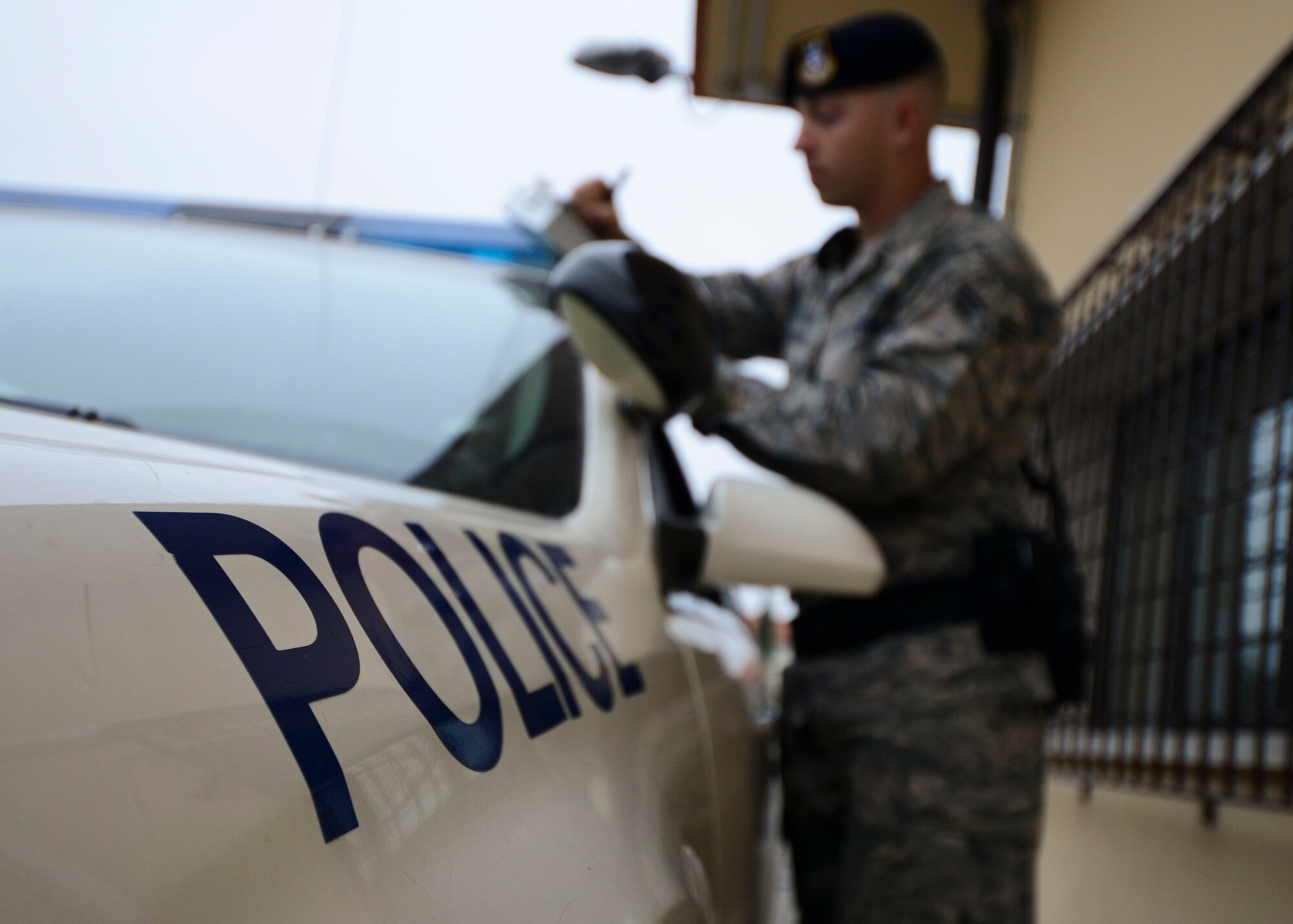 U.S. Air Force Senior Airman Curtis Brewer, 31st Security Forces Squadron patrolman, reviews notes at the conclusion of his shift, Nov. 18, 2015, at Aviano Air Base, Italy. Patrolmen create in-depth reports to annotate specific details about an incident. (U.S. Air Force photo by Senior Airman Austin Harvill/Released)
