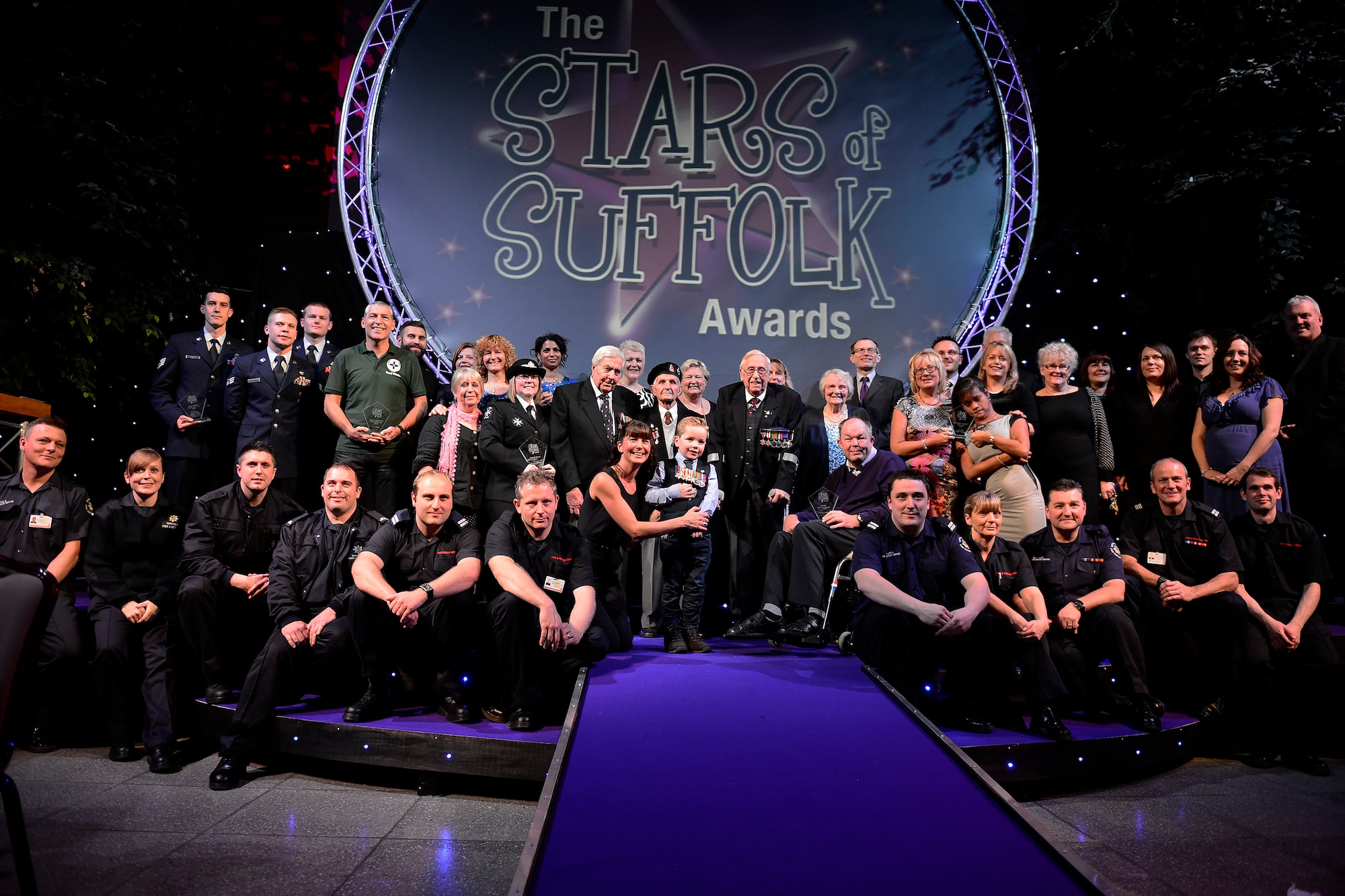 The winners of the Stars of Suffolk awards ceremony pose for a photo after the event in Ipswich, England, Nov. 19, 2015. Four Airmen from Royal Air Force Lakenheath, England, were awarded the Armed Services of the Year award for their heroic actions after a Hellenic air force F-16 crash during an exercise in Spain. (U.S. Air Force photo by Airman 1st Class Erin R. Babis/Released)