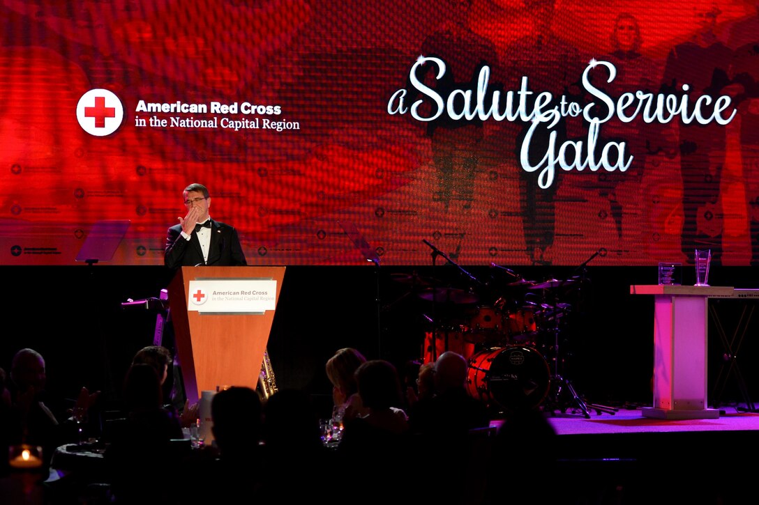 Defense Secretary Ash Carter sends a kiss to former North Carolina Sen. Elizabeth Dole during the “A Salute to Service Gala” event at the Hilton Hotel in McLean, Va., Nov. 20, 2015. Carter received the Lifetime of Service award during the event, and Dole also received an award. U.S. Army Photo by Sgt. Jose A. Torres Jr.