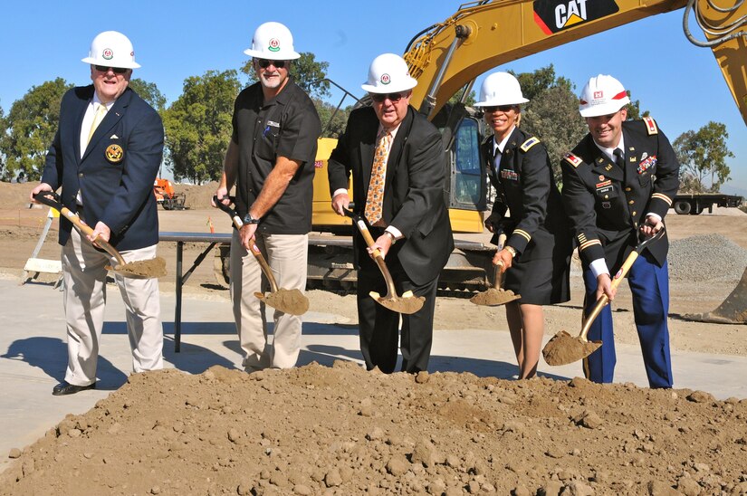 From left to right, Mike Teilman, Army Reserve ambassador (California), Todd Gillum, president of Cox Construction, Charles Puckett, mayor of Tustin, Chief Warrant Officer 5 Belynda Lindsey, command chief warrant officer, 63rd Regional Support Command, and Lt. Col. Dennis Sugrue, deputy commander, Army Corps of Engineers, Los Angeles District, perform the traditional breaking of ground with gold shovels, during a groundbreaking ceremony, Nov. 19, Tustin, Calif., in support of the new Tustin Army Reserve Center, to be completed by 2017.