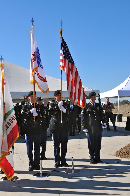The 79th Sustainment Support Command Honor Guard retrieves the colors at the conclusion of the Tustin Army Reserve Center Groundbreaking Ceremony, Nov. 19, Tustin, Calif.