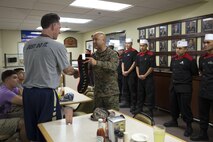Marines present Jamie Dixon, the head coach of University of Pittsburgh Men’s Basketball Team, with a stocking Nov. 12 on Marine Corps Air Station Futenma, Okinawa, Japan. The stocking was pinned with the different ranks of the Marines working at the mess hall.   Pittsburgh faced off against Gonzaga University in the ESPN Armed Forces Classic Basketball Game held on Okinawa. This marked the fourth year the Armed Forces Classic was held and the second time it was played in East Asia.