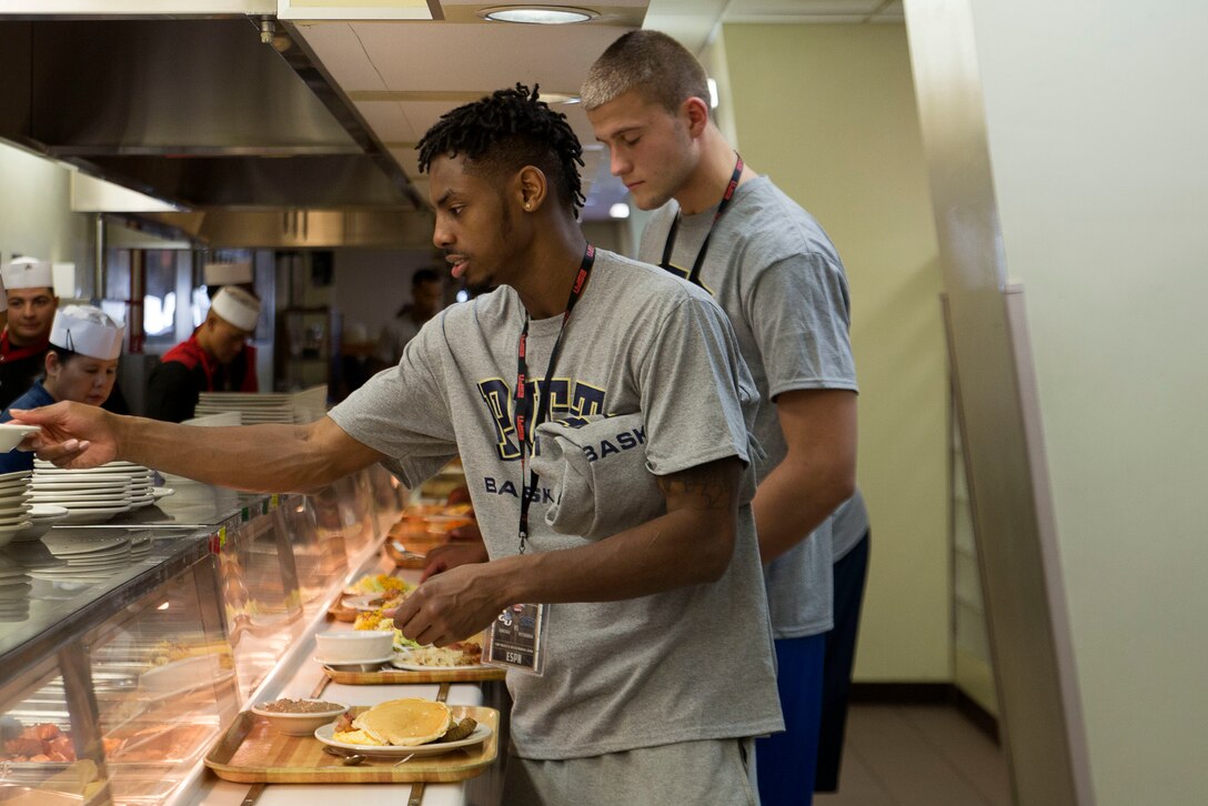 Players from the University of Pittsburgh Men’s Basketball Team have brunch at the Mess Hall Nov. 12 on Marine Corps Air Station Futenma, Okinawa, Japan. The team faced off against Gonzaga University in the ESPN Armed Forces Classic Basketball Game held on Okinawa. This marked the fourth year the Armed Forces Classic was held and the second time it was played in East Asia.