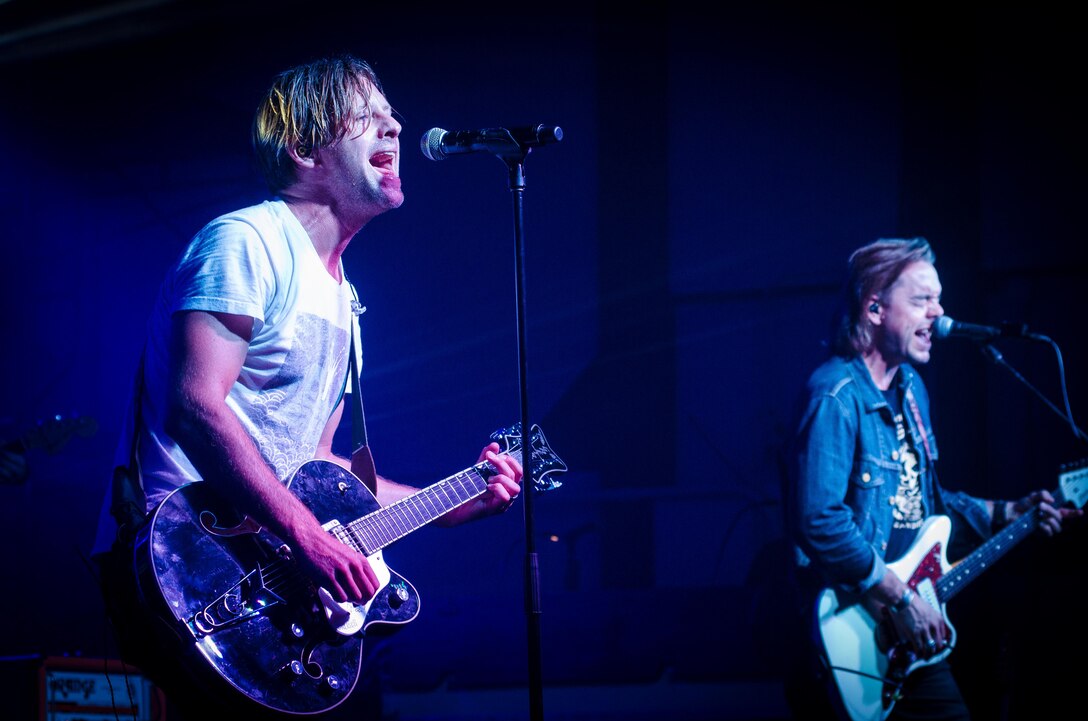 Switchfoot frontman Jon Foreman, left, and guitarist Drew Shirley perform one of their hit songs Nov. 21, 2015, at Andersen Air Force Base, Guam. The band travelled to the island to perform two free concerts for service members and families. (U.S. Air Force photo by Staff Sgt. Alexander W. Riedel/Released)