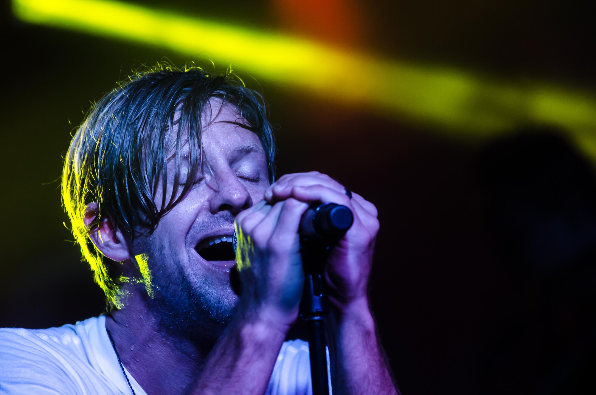 Switchfoot frontman Jon Foreman sings his band's hit song Dare You To Move Nov. 21, 2015, at Andersen Air Force Base, Guam. The Grammy Award-winning band visited the island to perform tribute concerts for service members and families. (U.S. Air Force photo by Staff Sgt. Alexander W. Riedel/Released)