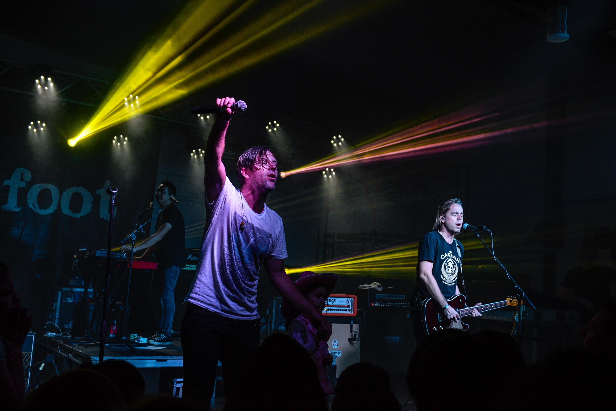 Switchfoot frontman Jon Foreman holds his microphone toward the audience Nov. 21, 2015, at Andersen Air Force Base, Guam. The San Diego-based alternative rock band performed two free concerts for service members and families assigned to the island. (U.S. Air Force photo by Staff Sgt. Alexander W. Riedel/Released)