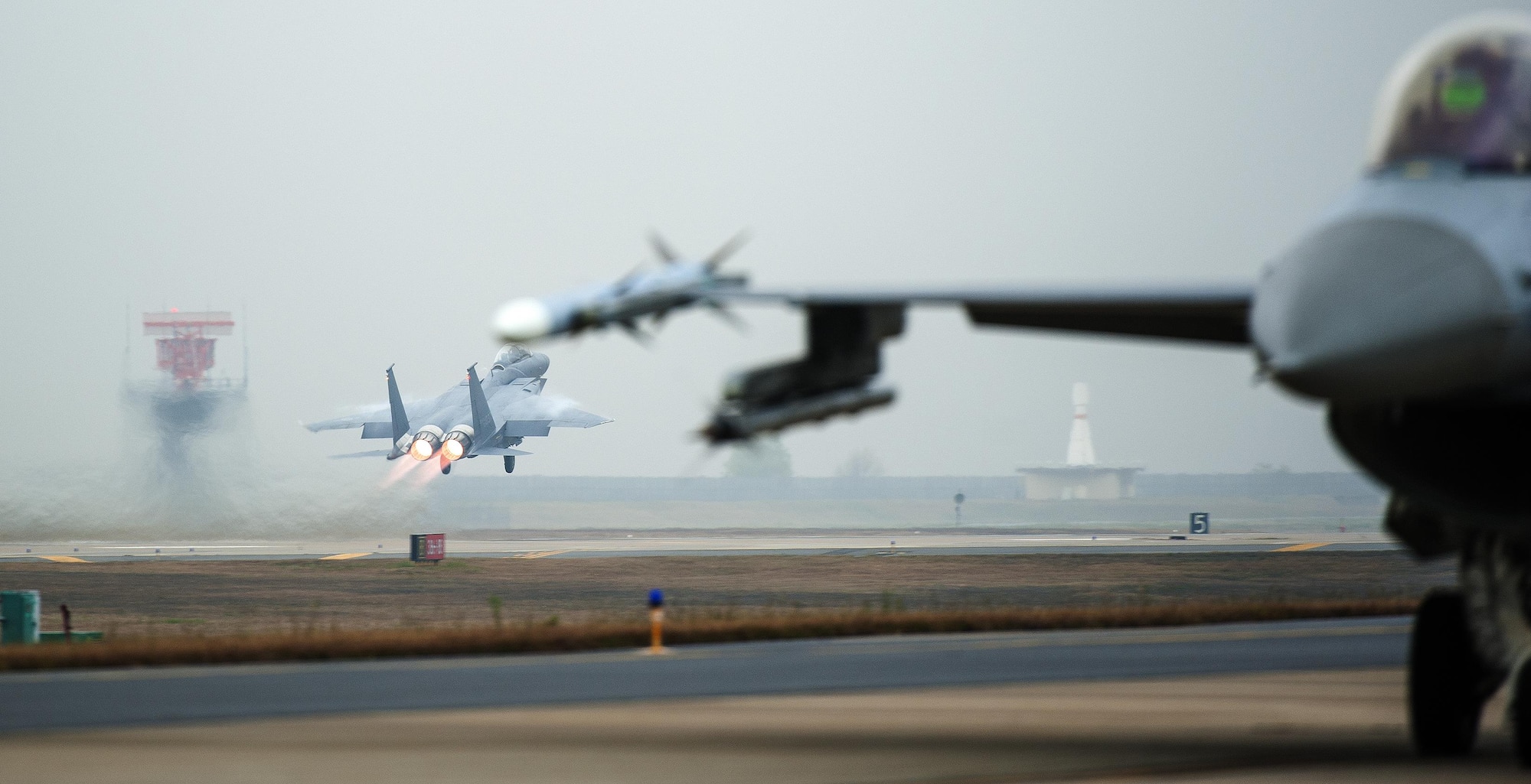 A Republic of Korea air force F-15K Slam Eagle from the 11th Fighter Wing, Daegu, takes off as part of Buddy Wing 15-7 at Kunsan Air Base, Republic of Korea, Nov. 17, 2015. During the five-day exercise, pilots from the 8th Fighter Wing exchanged tactics and procedures with their ROKAF counterparts. (U.S. Air Force photo by Staff Sgt. Nick Wilson/Released)   