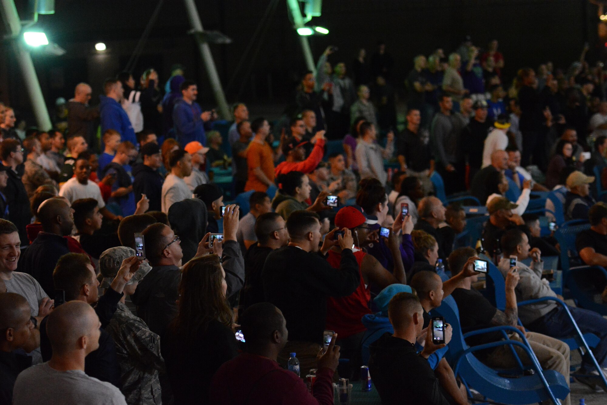 Deployed service members at Al Udeid Air Base, Qatar watch Bikes Over Baghdad, a professional BMX group, perform at the base Nov. 22. During the performance the group performed several tricks and stunts. Bikes Over Baghdad tours the world performing for service members. After their show they also met with service members and signed autographs. (U.S. Air Force photo by Tech. Sgt. James Hodgman/Released)
