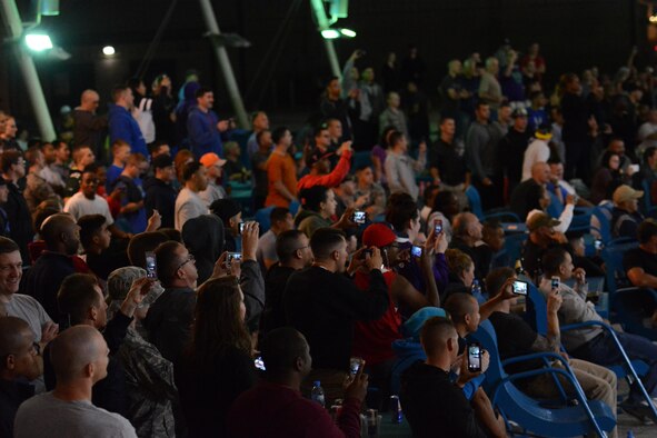 Deployed service members at Al Udeid Air Base, Qatar watch Bikes Over Baghdad, a professional BMX group, perform at the base Nov. 22. During the performance the group performed several tricks and stunts. Bikes Over Baghdad tours the world performing for service members. After their show they also met with service members and signed autographs. (U.S. Air Force photo by Tech. Sgt. James Hodgman/Released)