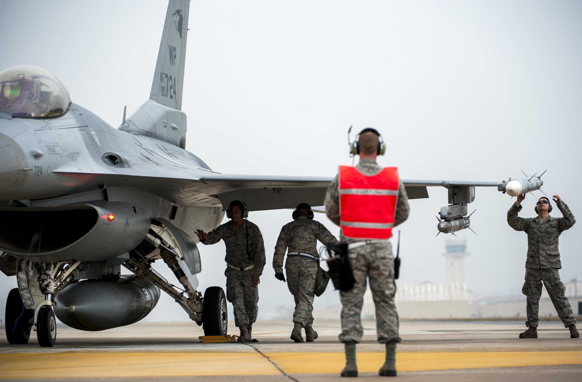Airmen from the 8th Aircraft Maintenance Squadron conduct a preflight inspection on an F-16 Fighting Falcon as part of Buddy Wing 15-7 at Kunsan Air Base, Republic of Korea, Nov. 17, 2015. Buddy Wing is part of a combined fighter exchange program designed to improve interoperability between U.S. Air Force and ROKAF fighter squadrons and are conducted multiple times throughout the year in order to promote cultural awareness and sharpen combined combat capabilities. (U.S. Air Force photo by Staff Sgt. Nick Wilson/Released)