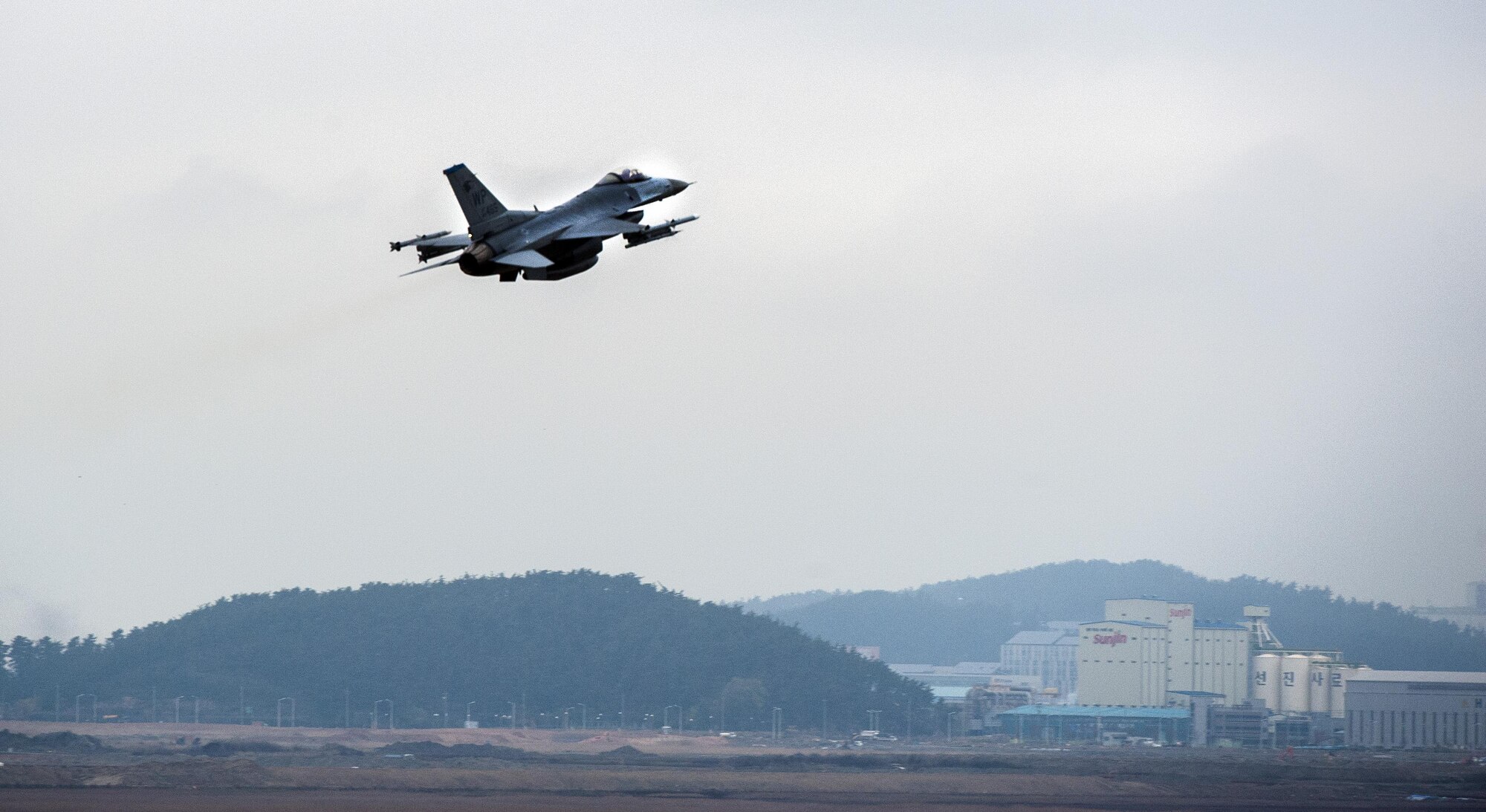 An F-16 Fighting Falcon from the 8th Fighter Wing takes off as part of Buddy Wing 15-7 at Kunsan Air Base, Republic of Korea, Nov. 17, 2015. Buddy Wing is part of a combined fighter exchange program designed to improve interoperability between U.S. Air Force and ROKAF fighter squadrons and are conducted multiple times throughout the year in order to promote cultural awareness and sharpen combined combat capabilities. (U.S. Air Force photo by Staff Sgt. Nick Wilson/Released)
