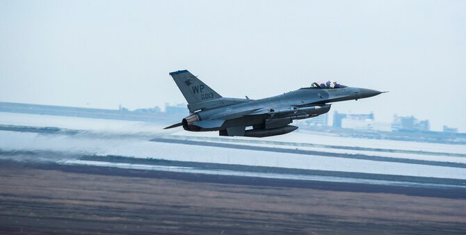 An F-16 Fighting Falcon from the 8th Fighter Wing takes off as part of Buddy Wing 15-7 at Kunsan Air Base, Republic of Korea, Nov. 17, 2015. Buddy Wing is part of a bilateral fighter exchange program designed to improve interoperability between U.S. Air Force and ROKAF fighter squadrons and are conducted multiple times throughout the year in order to promote cultural awareness and sharpen combined combat capabilities. (U.S. Air Force photo by Staff Sgt. Nick Wilson/Released)