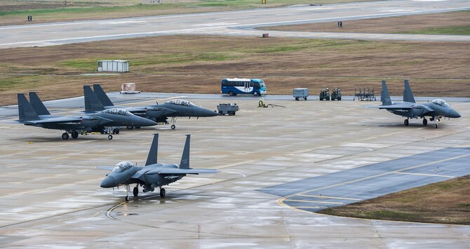 Republic of Korea air force F-15K Slam Eagles from the 11th Fighter Wing, Daegu, taxi on the runway during Buddy Wing 15-7 at Kunsan Air Base, Republic of Korea, Nov. 19, 2015. Wolf Pack Airmen trained alongside Airmen of the 11th Fighter Wing, learning how to operate as one force with dissimilar fighter aircraft. (U.S. Air Force photo by Staff Sgt. Nick Wilson/Released)