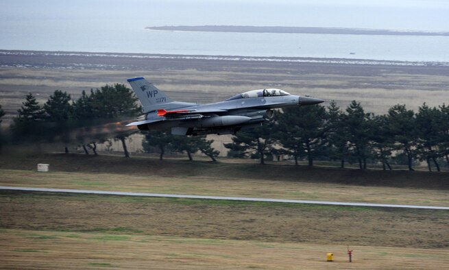 An F-16 Fighting Falcon from the 8th Fighter Wing prepares for takeoff as part of Buddy Wing 15-7 at Kunsan Air Base, Republic of Korea, Nov. 19, 2015. Buddy Wing is part of a bilateral fighter exchange program designed to improve interoperability between U.S. Air Force and ROKAF fighter squadrons and are conducted multiple times throughout the year in order to promote cultural awareness and sharpen combined combat capabilities. (U.S. Air Force photo by Staff Sgt. Nick Wilson/Released)