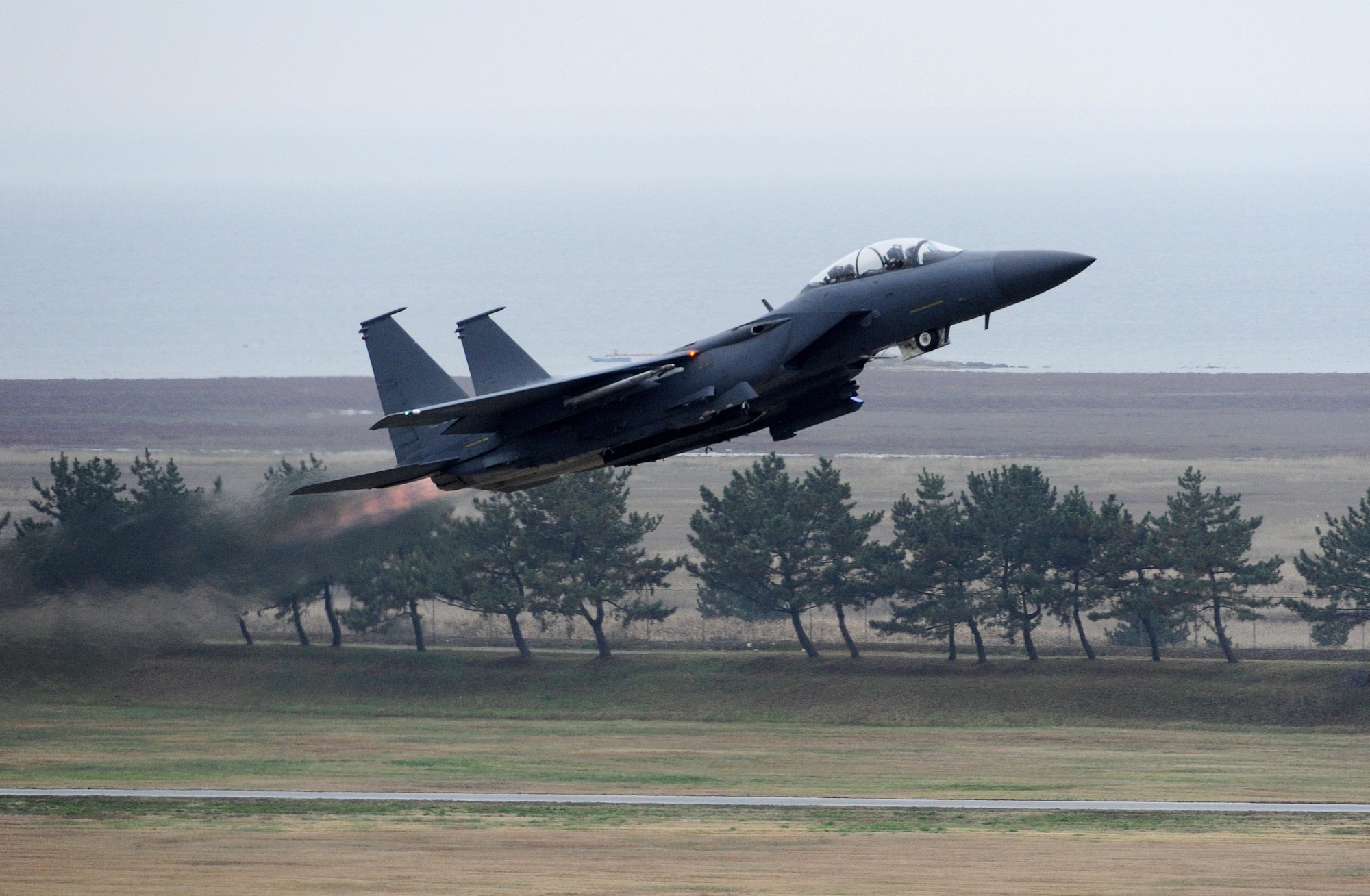 An F-15K Slam Eagle from the 11th Fighter Wing, Daegu Air Base, Republic of Korea, takes off of the runway during Buddy Wing 15-7 at Kunsan Air Base, Republic of Korea, Nov. 16, 2015. Buddy Wing is part of a bilateral fighter exchange program designed to improve interoperability between U.S. Air Force and ROKAF fighter squadrons and are conducted multiple times throughout the year in order to promote cultural awareness and sharpen combined combat capabilities. (U.S. Air Force photo by Staff Sgt. Nick Wilson/Released)