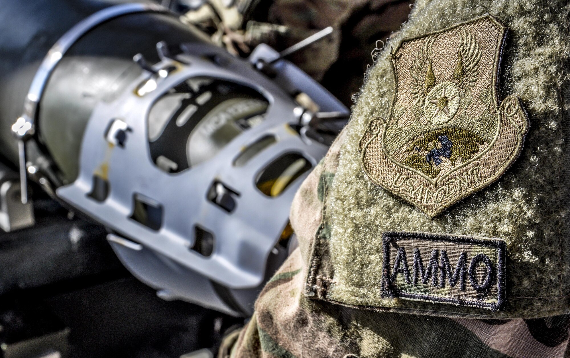 Airman Morgan Matteson, 455th Expeditionary Maintenance Squadron munitions flight apprentice, deployed from Hill Air Force Base, Utah, builds a GBU-54 500 pound bomb at Bagram Airfield, Afghanistan, Nov. 17, 2015. The AMMO flight provides necessary weapons and countermeasures required to project combat airpower. (U.S. Air Force photo by Tech. Sgt. Nicholas Rau/Released)