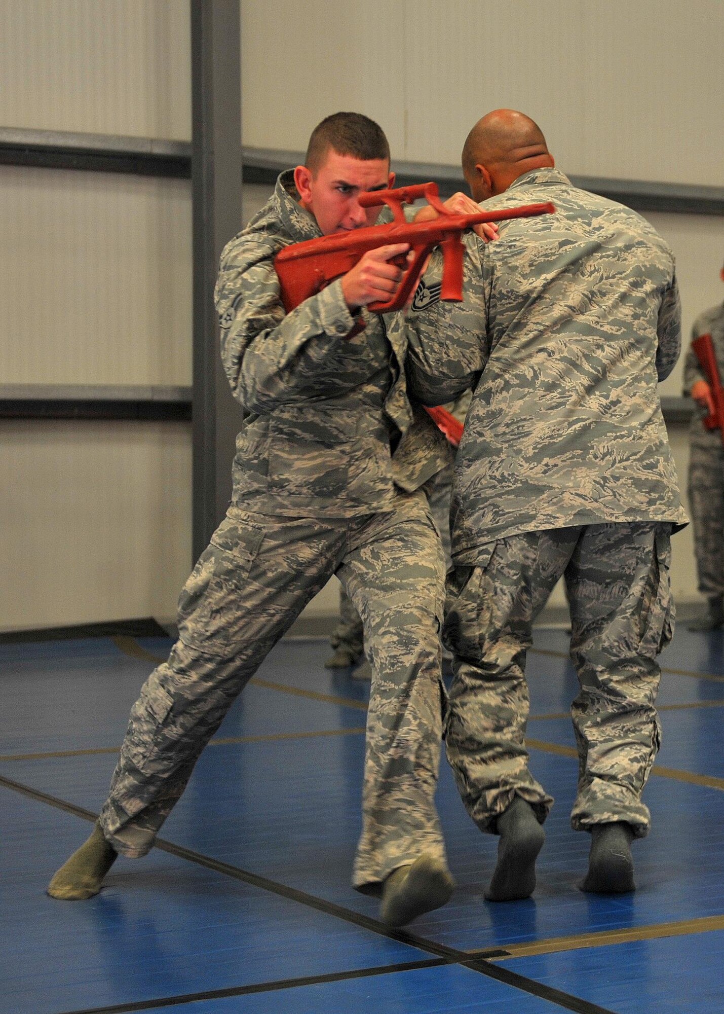 Senior Airman Phillip learns how to subdue a potential threat during the weapons control portion of combatives training here, Oct. 15, 2015.  Techniques included learning basic unarmed strikes, weapon control and various body positions from the standing, kneeling and prone.  (U.S. Air Force photo/Staff Sgt. Kentavist Brackin)