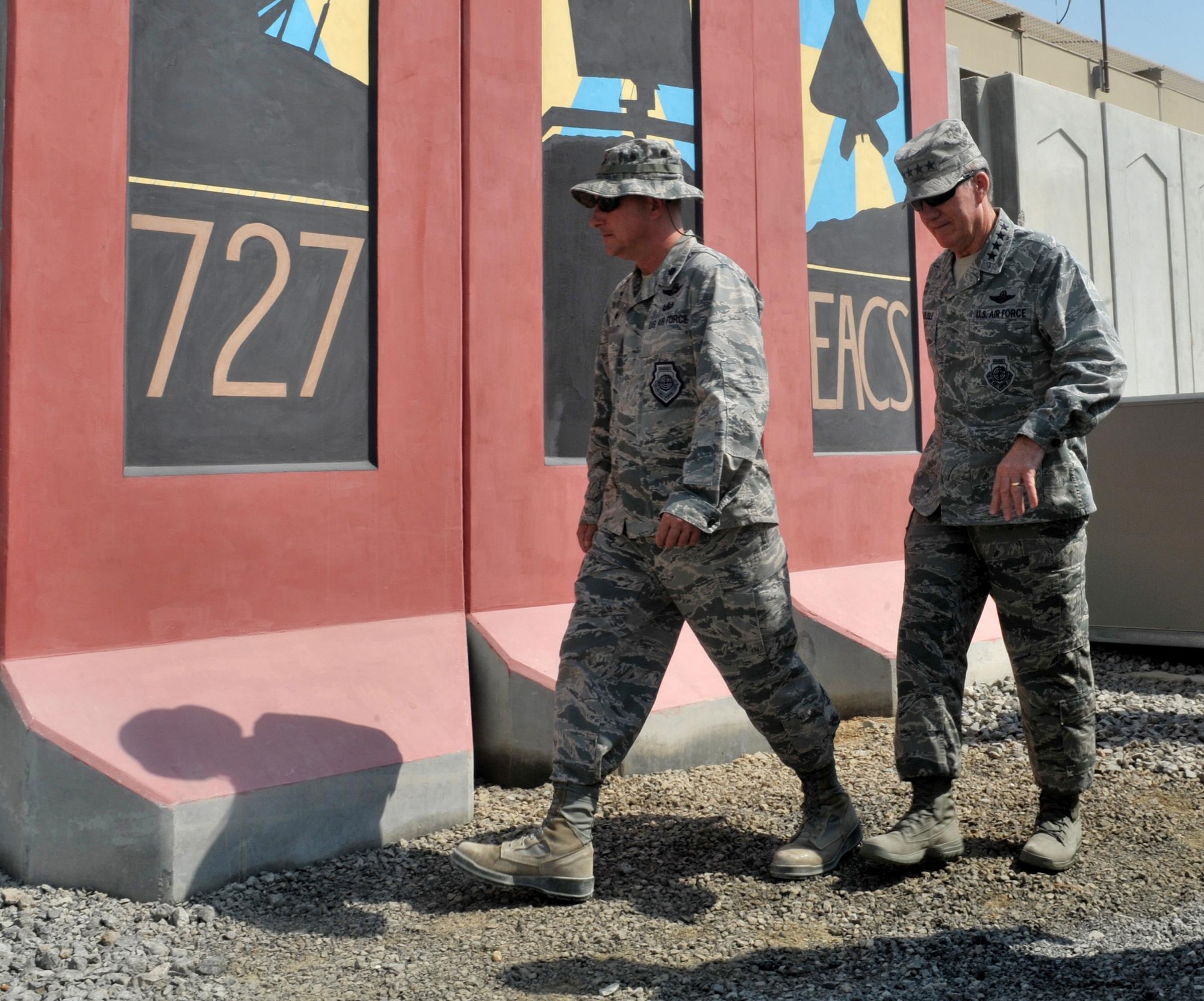 Lt. Col. Alan, 727th Expeditionary Air Control Squadron commander, gives Gen. Hawk Carlisle, commander of Air Combatant Command, a tour of the air control facility at an undisclosed location in Southwest Asia, Oct. 19, 2015. The 727th EACS uses real-time radar surveillance to provide command and control capabilities to airmen, soldiers and coalition partners, allowing them to coordinate the movement of aircraft through the battle space while monitoring the skies. (U.S. Air Force photo by Staff Sgt. Kentavist Brackin/Released)