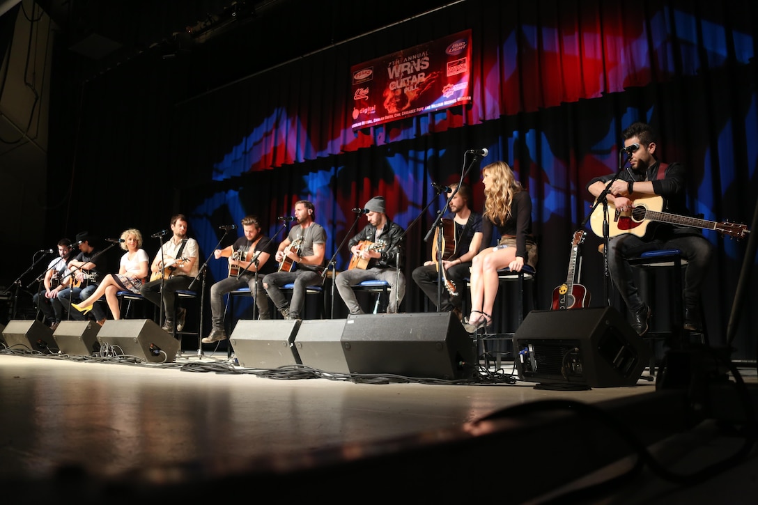 Country music artists perform their hit songs and tell stories for a crowd of nearly 2,000 Marines, Sailors and community members during the 7th annual WRNS Guitar Pull at Marine Corps Air Station Cherry Point, N.C., Nov. 19, 2015. The free concert which was hosted by Marine Corps Community Services and local country music radio station WRNS. The guitar pull featured talents including William Michael Morgan, Cam, Canaan Smith, Cassadee Pope and Waterloo Revival.  (U.S. Marine Corps Photo By Cpl. N.W. Huertas/Released)