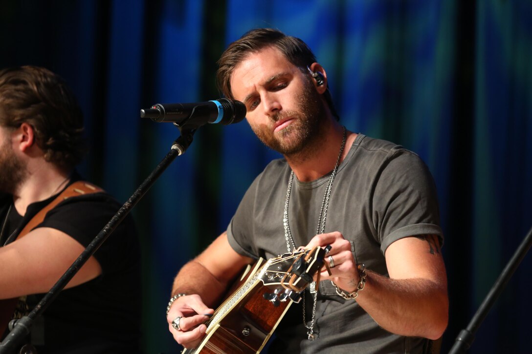 Country music artist Canaan Smith tunes his guitar before performing for a crowd of nearly 2,000 Marines, Sailors and community members during the 7th annual WRNS Guitar Pull at Marine Corps Air Station Cherry Point, N.C., Nov. 19, 2015. The free concert which was hosted by Marine Corps Community Services and local country music radio station WRNS. The guitar pull featured talents including William Michael Morgan, Cam, Canaan Smith, Cassadee Pope and Waterloo Revival. (U.S. Marine Corps Photo By Cpl. N.W. Huertas/Released)