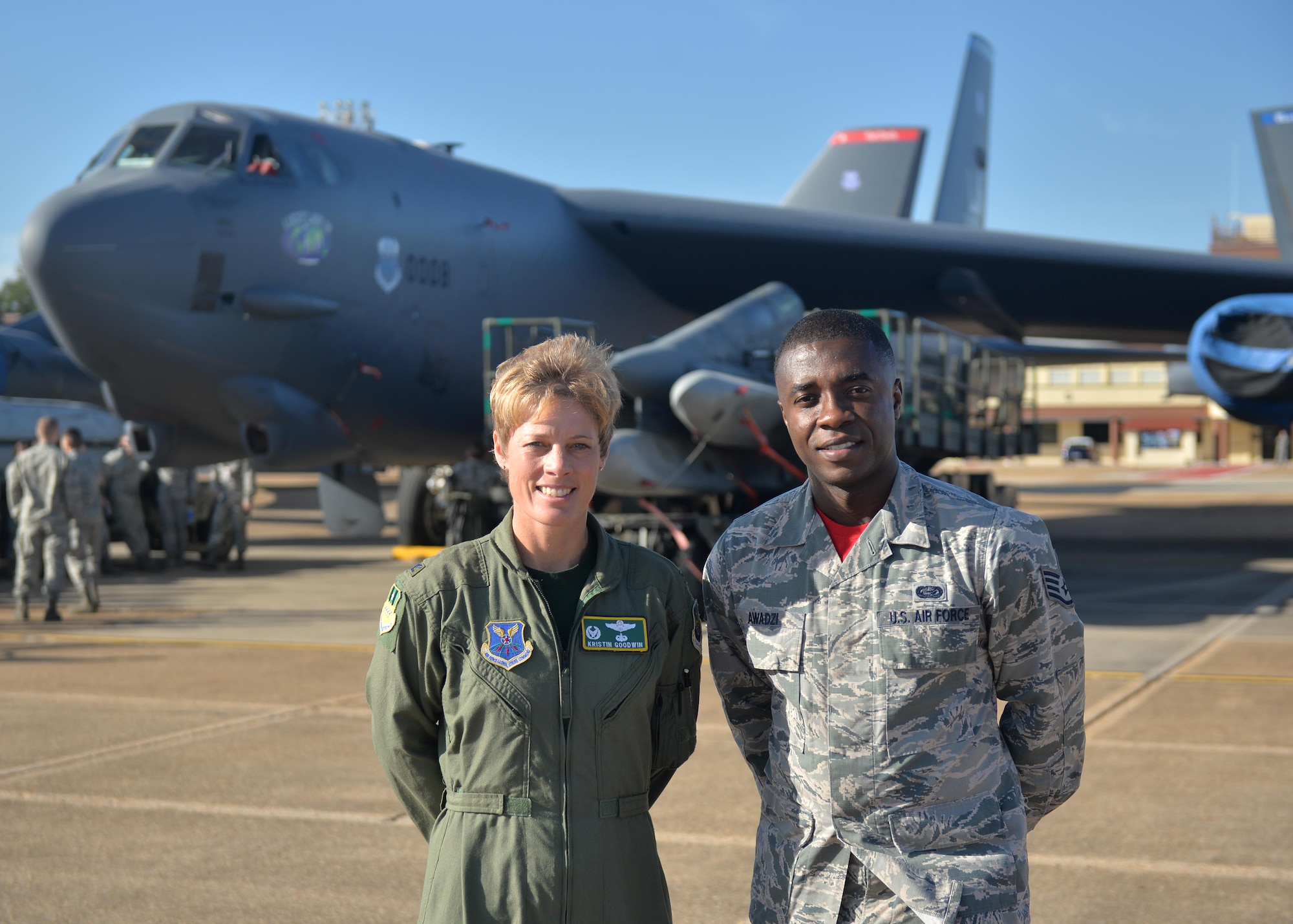 Col. Kristin Goodwin, 2nd Bomb Wing commander, and Staff Sgt. Desmond Awadzi, 2nd Force Support Squadron promotions NCO-in-charge, pose for a photo in front of a B-52 Stratofortress at Barksdale Air Force Base, La., Oct. 16, 2015. Awadzi has been personally selected by Chief of Staff of the Air Force Gen. Mark Welsh for a slot at Officer Training School under the Senior Leader Enlisted Commissioning Program. (U.S. Air Force photo/ Airman 1st Class Mozer O. DaCunha)
