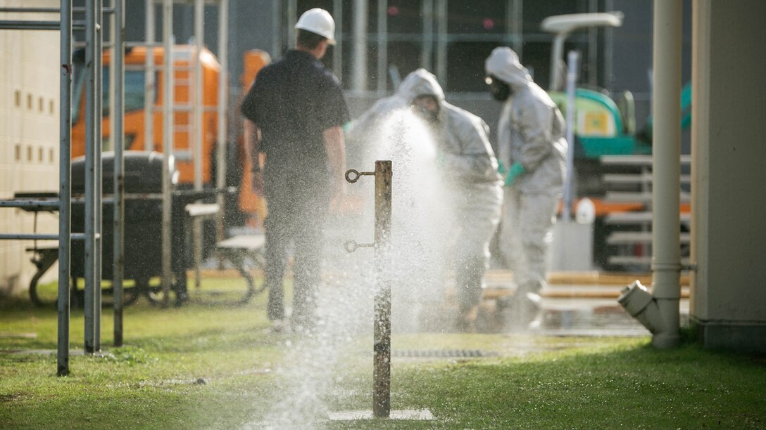 Participants of the Hazardous Material Awareness and Operations course practice operating a fire hose during the course at Marine Corps Air Station Iwakuni, Japan, Nov. 19, 2015. Being on a military installation, service members may come into contact with hazardous materials such as weapons, explosives and fuels as well as common household chemicals used on base such as chlorine found in pools or even cleaning products; so service members and firefighters trained for recognition as first responders in a hazardous material incident during the course.  