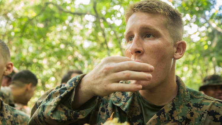 U.S. Marine Lance Cpl. Shawn Smith tries crab cooked over an open fire in a jungle survival course during Malaysia-United States Amphibious Exercise 2015 in Tanduo, Malaysia on Nov. 11. Smith is a mortar man with Kilo Company, Battalion Landing Team 3rd Battalion, 1st Marine Regiment, 15th Marine Expeditionary Unit. During the course, Marines learned how to trap, clean, and cook wildlife from Malaysian soldiers. The purpose of the exercise was to strengthen military cooperation in the planning and execution of amphibious operations between Malaysian armed forces and U.S. Marines. The 15th MEU is currently deployed in the Indo-Asia-Pacific region to promote regional stability and security in the U.S. 7th Fleet area of operations. 