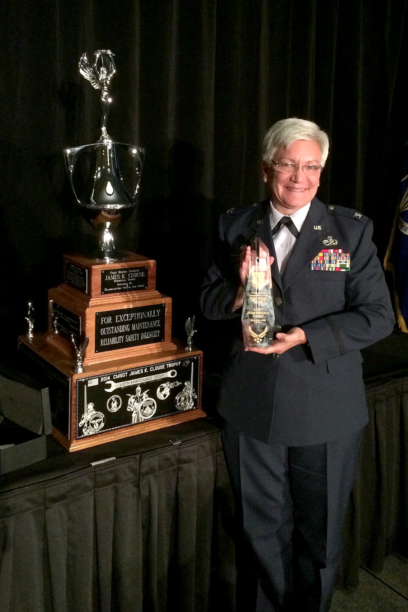 Col. Anna Schulte, 434th Maintenance Group commander, poses with the Chief Master Sgt. James K. Clouse Trophy at March Air Reserve Base, Calif., Nov. 11, 2015. The award is presented to recognize excellence among maintenance organizations within Fourth Air Force. (U.S. Air Force photo)