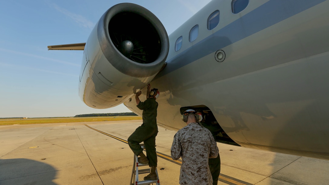 Members of Marine Transport Squadron 1 conduct engine maintenance on a C-9B Skytrain on Cherry Point Oct. 17 after its return from a routine mission.  VMR-1 is the only squadron in the Marine Corps to maintain and fly the aircraft.