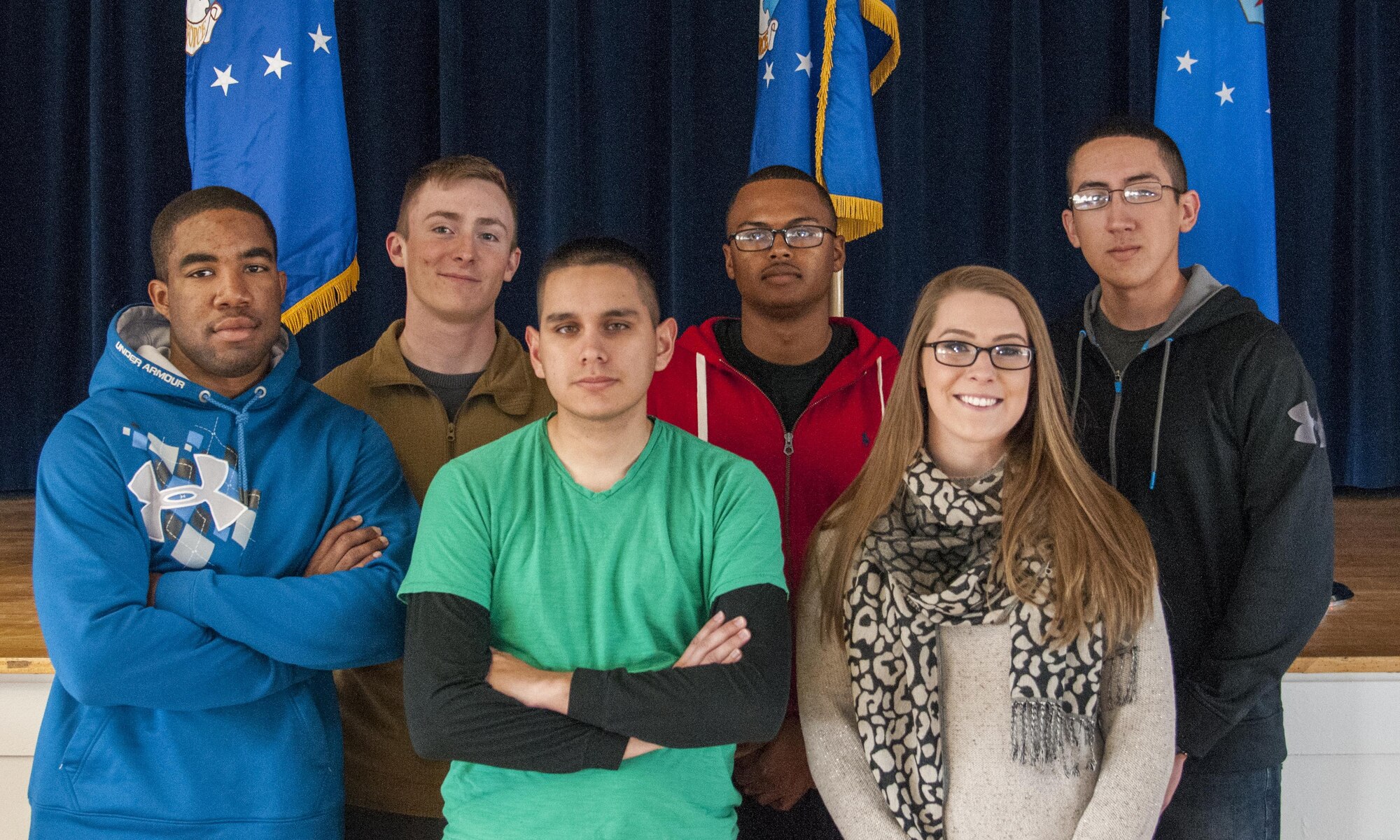 (From left to right) Senior Airman Tyree Wright, 90th Maintenance Operations Squadron Vehicles and Equipment Section technician; Senior Airman Devin Mooney, 321st Missile Squadron Personnel Reliability Program monitor; Airman 1st Class Robert Andrade, 90th Civil Engineer Squadron heating, ventilation and air conditioning technician; Airman 1st Class Jabron Sparks, 790th Missile Security Forces Squadron; Senior Airman Nina Jones, 90th Medical Group Commander's Support Staff; and Airman 1st Class Roberto Apodaca, 90th MSFS -- all of whom are 90th Missile Wing Honor Guard ceremonial guardsmen -- pose for a photo in the Pronghorn Center on F.E. Warren Air Force Base, Wyo., Nov. 20, 2015. The Airmen helped an 18-wheeler driver stay safe and warm until emergency responders arrived on scene Nov. 18, 2015. (U.S. Air Force photo by Senior Airman Jason Wiese)