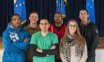 (From left to right) Senior Airman Tyree Wright, 90th Maintenance Operations Squadron Vehicles and Equipment Section technician; Senior Airman Devin Mooney, 321st Missile Squadron Personnel Reliability Program monitor; Airman 1st Class Robert Andrade, 90th Civil Engineer Squadron heating, ventilation and air conditioning technician; Airman 1st Class Jabron Sparks, 790th Missile Security Forces Squadron; Senior Airman Nina Jones, 90th Medical Group Commander's Support Staff; and Airman 1st Class Roberto Apodaca, 90th MSFS -- all of whom are 90th Missile Wing Honor Guard ceremonial guardsmen -- pose for a photo in the Pronghorn Center on F.E. Warren Air Force Base, Wyo., Nov. 20, 2015. The Airmen helped an 18-wheeler driver stay safe and warm until emergency responders arrived on scene Nov. 18, 2015. (U.S. Air Force photo by Senior Airman Jason Wiese)