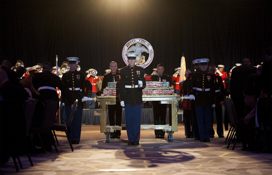 Marines assigned to Marine Barracks Washington present the birthday cake during the the 240th Marine Corps birthday celebration  in Washington, D.C., Nov. 21, 2015. Marine Corps Gen. Joseph F. Dunford Jr., the chairman of the Joint Chiefs of Staff, served as the event's guest of honor and keynote speaker. DoD photo by Petty Officer 2nd Class Dominique A. Pineiro