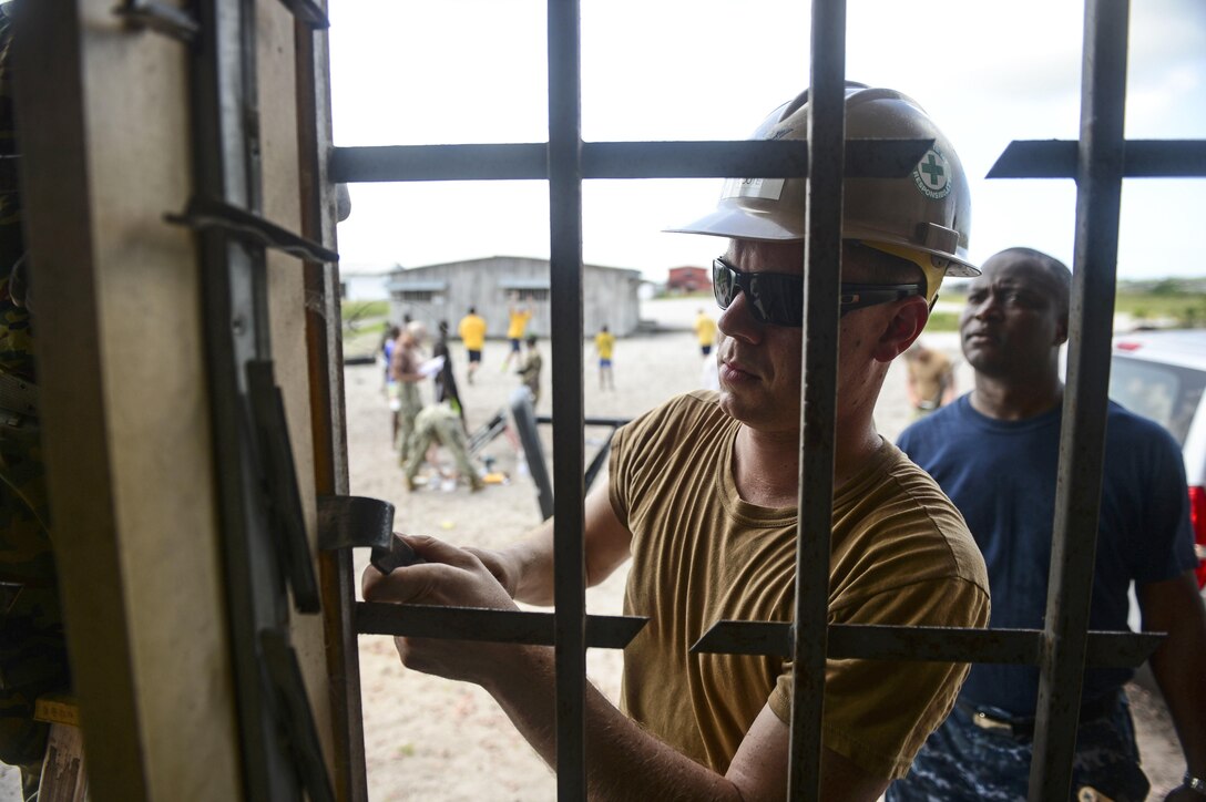 Navy Petty Officer 3rd Class Joshua Coote helps refurbish the Centre Esperance Mission orphanage in Port Gentil, Gabon. DLA Troop Support Construction and Equipment's maintenance, repair and operations program contracts are able to provide material and support to various locations where U.S. military personnel may be deployed.