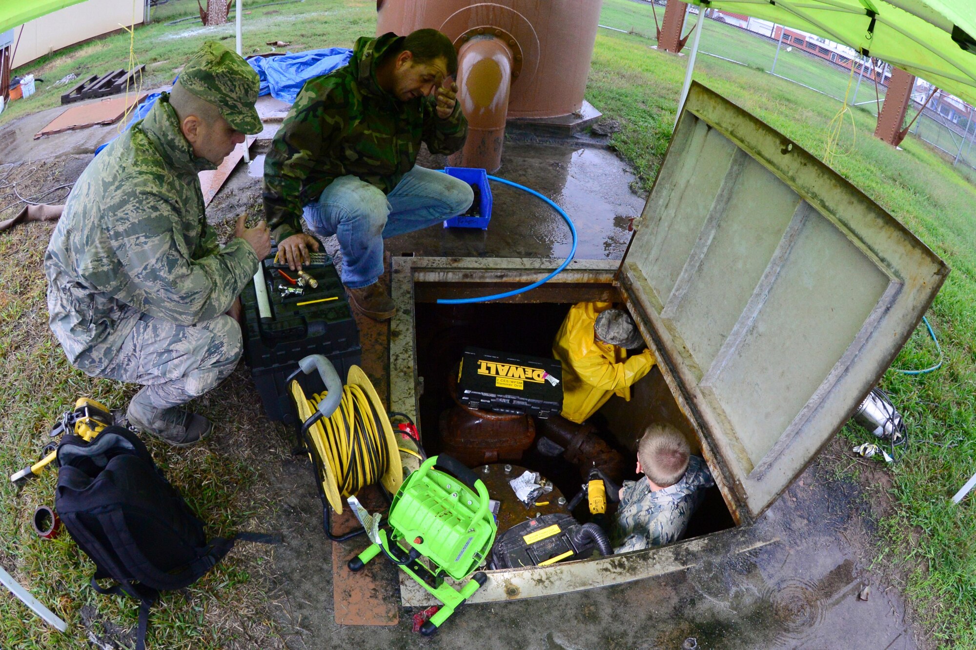 Airmen from the 2nd Civil Engineer Squadron water and fuel systems replace sensing wire to a water tower outside main gate on Barksdale Air Force Base, La., Nov. 17, 2015. The sensing line detects how much water is in the tower and prevents it from overfilling. (U.S. Air Force Photo/Airman 1st Class Luke Hill)
