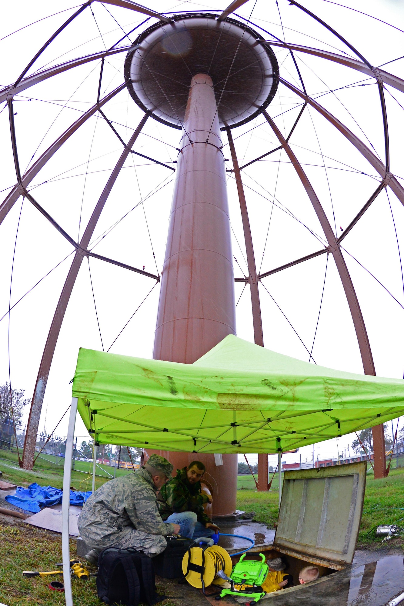 Airmen from the 2nd Civil Engineer Squadron water and fuel systems replace sensing wire to a water tower outside main gate on Barksdale Air Force Base, La., Nov. 17, 2015. The main gate water tower provides water for all the squadrons and dorms on main base. (U.S. Air Force Photo/Airman 1st Class Luke Hill)